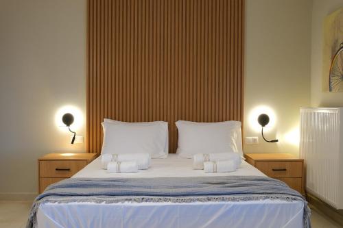 a bedroom with a large bed with two white pillows at Villa 1868 in Mithymna