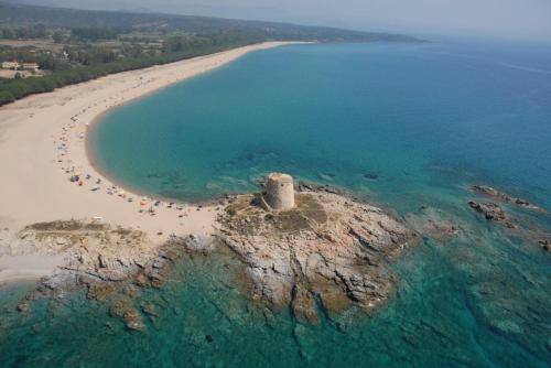 an aerial view of a small island in the ocean at Guido Holiday Home - Torre di Barì in Bari Sardo