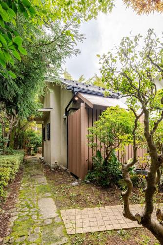 a house with a walkway in front of it at 楽宿 藤花 046h in Hakone