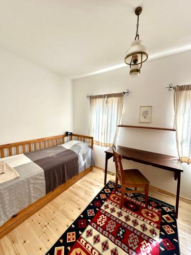 a bedroom with a bed and a piano at The Red Konak in Veliko Tŭrnovo