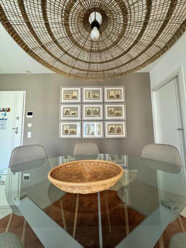 a dining room with a glass table with two chairs at Il Parco 11 by Quokka 360 - in the business centre of Lugano in Lugano
