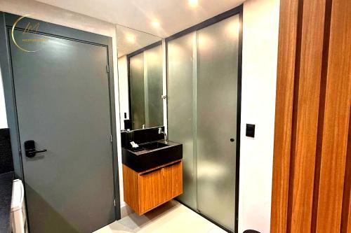 a bathroom with a sink and a mirror at Lm Get Sense in João Pessoa