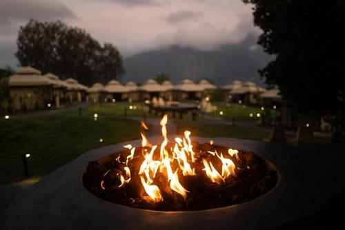 a fire pit in a yard at night at Toteme Glamping and Hot Spring Kintamani in Kintamani