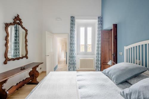 Postel nebo postele na pokoji v ubytování Appartamento in Palazzo Bucelli