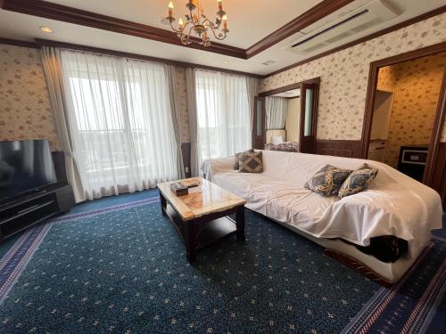 Postel nebo postele na pokoji v ubytování Spa Resort LiVEMAX