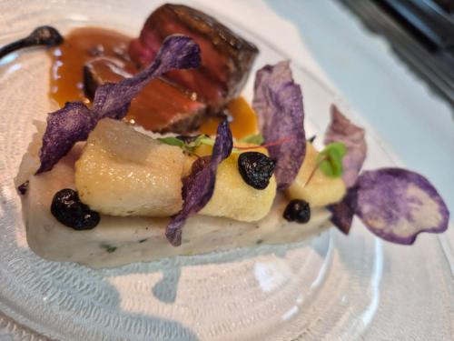 a plate with a piece of food on it at CAZAUDEHORE Hôtel Restaurant Gastronomique Terrasse et Jardins in Saint-Germain-en-Laye