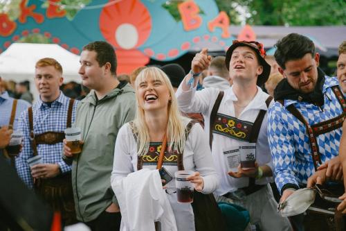a group of people standing in a crowd at Munich Oktoberfest and Springfest All-Inclusive Festival Camping in Munich
