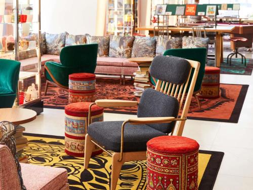 a store with colorful chairs and tables in a store at Mama Shelter Prague in Prague