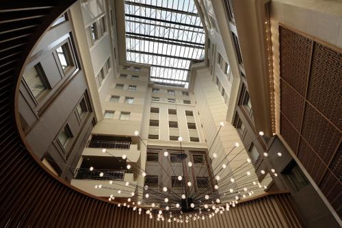 an overhead view of a building with a glass ceiling at Wyndham Grand Athens in Athens
