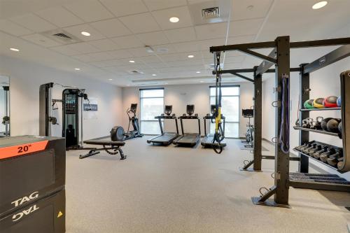 a gym with treadmills and weights in a building at Home2 Suites By Hilton Conway, Sc in Conway