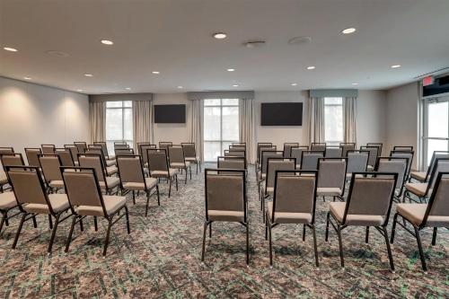 a conference room with chairs and screens in it at Home2 Suites By Hilton Conway, Sc in Conway