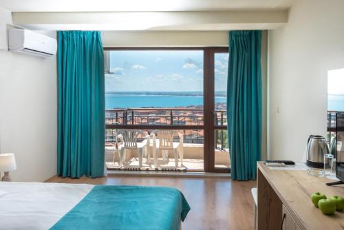 a hotel room with a view of the ocean at Sea View Hills in Sveti Vlas