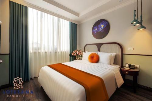 Lotusama Central Hanoi Hotelにあるベッド