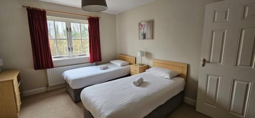 Postel nebo postele na pokoji v ubytování Bunratty Holiday Homes