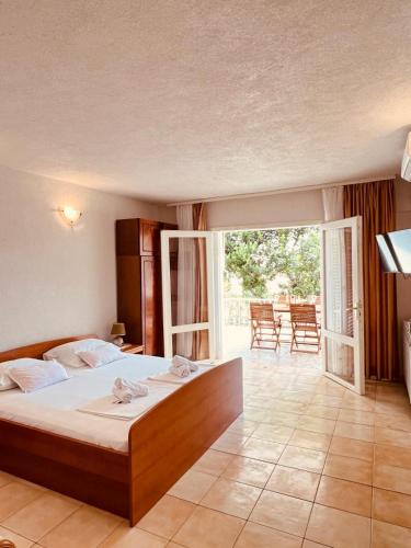 a bedroom with a large bed in a room at Villa H&M in Baška Voda