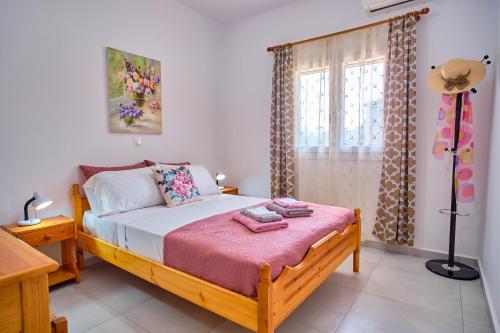 Ένα ή περισσότερα κρεβάτια σε δωμάτιο στο Stacys Apartments near Sidari