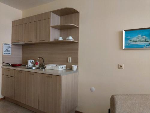 a kitchen with a sink and a counter top at Stephanovy Guest House in Sozopol