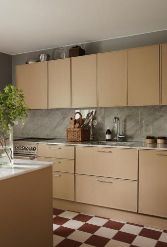 a kitchen with white cabinets and a sink at Stay North Matri House Liisa in Mathildedal