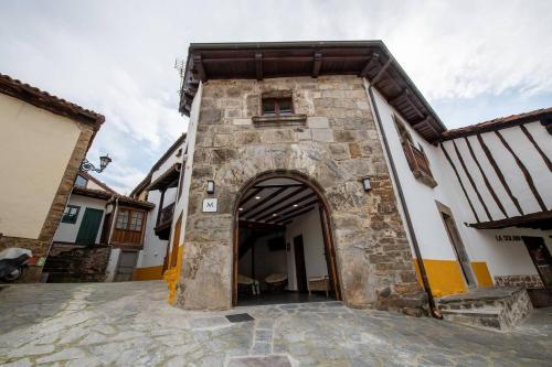 an entrance to a building with an archway at Miravilla 25 Potes 1 in Potes