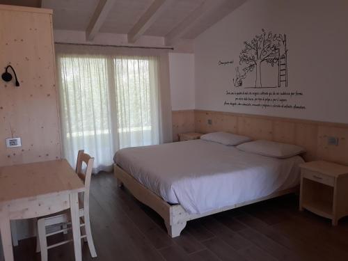 Posteľ alebo postele v izbe v ubytovaní Agriturismo L' Isola di Arturo