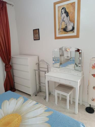 a bedroom with a desk and a dressing table at PM 15 Via Paolo Diacono in Buttrio