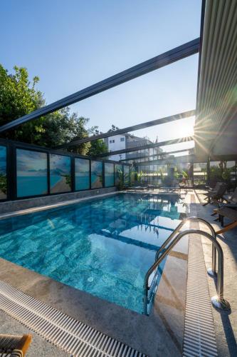 a large swimming pool on top of a building at Coastline Orange Hotel in Antalya