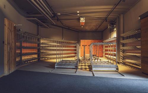 a room with empty horse stalls in a building at Mountain Plaza Hotel in Davos