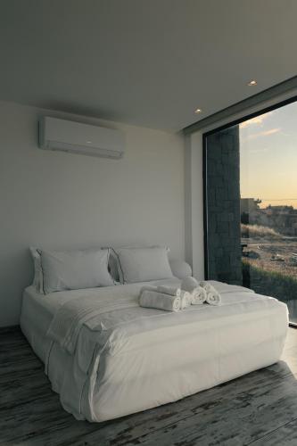 Кровать или кровати в номере Horizon Luxury Seafront Villa