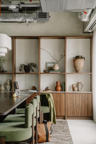 a dining room with a table and chairs at Mason & Fifth, Westbourne Park in London
