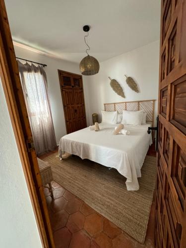 En eller flere senge i et værelse på Santa Lucia Sea View