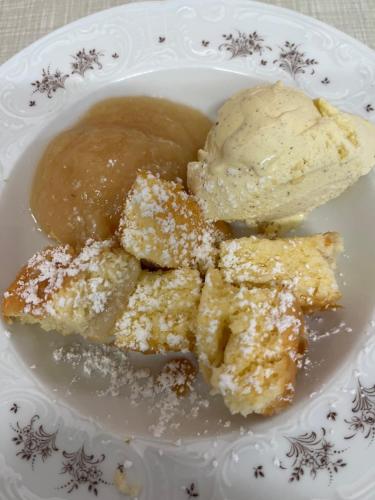 a plate of food with a scoop of ice cream at Gasthof ALTE POST in Waldachtal