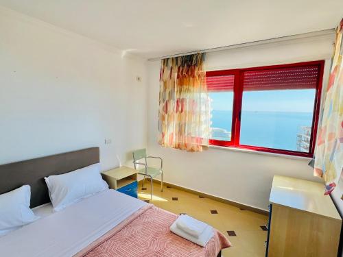 a bedroom with a bed and a window at Casa del Mar 2 in Durrës