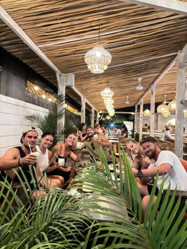 a group of naked people sitting in a bar at Tiki bar and more in Nusa Lembongan
