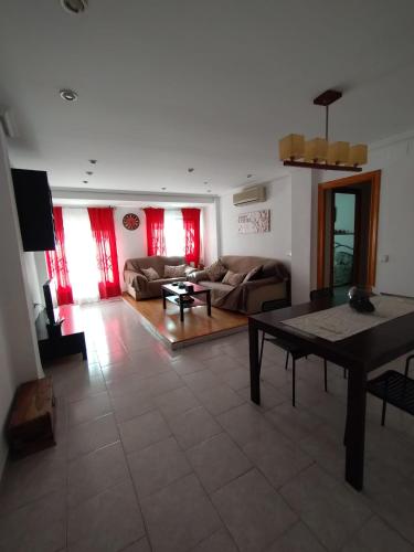 a living room with a couch and a table at valenia city in Valencia