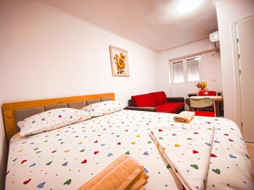 a bedroom with a large bed with colorful confederates at House of Linda 93 in Berat