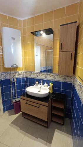 a bathroom with a sink and a mirror at Monix Homes-Villa Magic Garden in Kaş