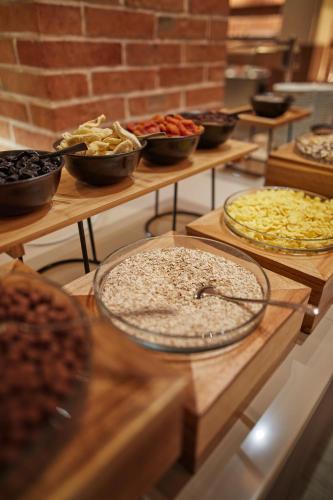 a buffet with many different types of pizzas on display at Villas with Balcony or Terrace - Hotel & Resort Adria Ankaran in Ankaran