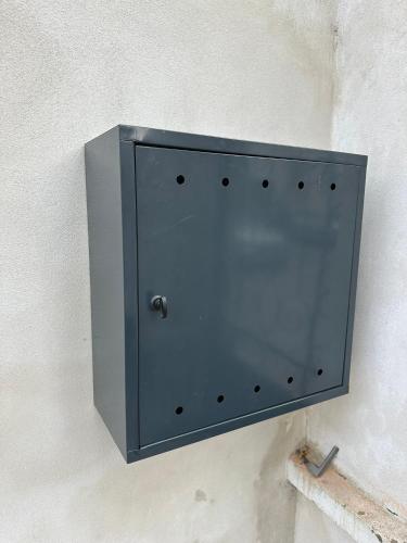 a metal box on the side of a wall at Vila Fráňa apartmán 3 in České Budějovice