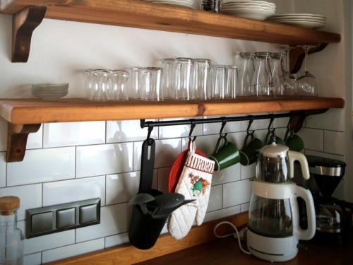 a kitchen rack with utensils on a wall at Abant Cozy Homes in Bolu