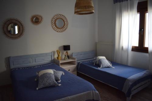 Postel nebo postele na pokoji v ubytování Platamon Boho Apartment- Με θέα την θάλασσα