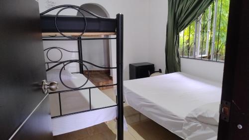 Postel nebo postele na pokoji v ubytování Cabaña El Refugio