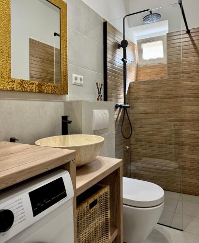 a bathroom with a sink and a toilet at Zio Nino in Sutomišćica