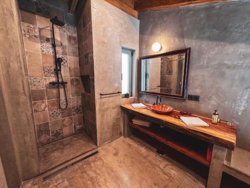 a bathroom with a sink and a shower at Quinta Camarena in Cercal