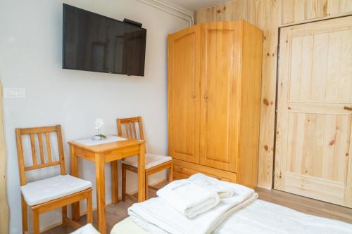 Ένα ή περισσότερα κρεβάτια σε δωμάτιο στο Pension Cerkovnik