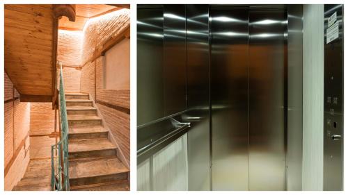 a metal refrigerator next to a staircase in a house at Casas de Trastámara by Toledo AP in Toledo