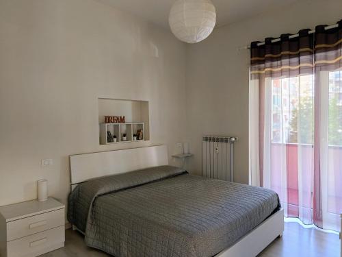 A bed or beds in a room at LA CASA DEI NONNI