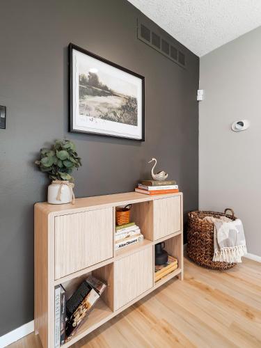 a book shelf in a room with a picture on the wall at 291 Hunter Ave bungalow 