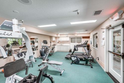 a gym with treadmills and exercise equipment in a room at Family Cabin in Blue Lake Springs, Near Town! in Arnold