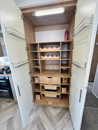 a kitchen with two old fashioned refrigerators at The Pink Lady in Walton-on-the-Naze