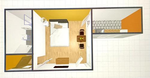 un dessin d'une petite pièce avec une porte donnant sur une salle de bain dans l'établissement Appartement cosy au cœur de Lorient - résidence calme, à Lorient